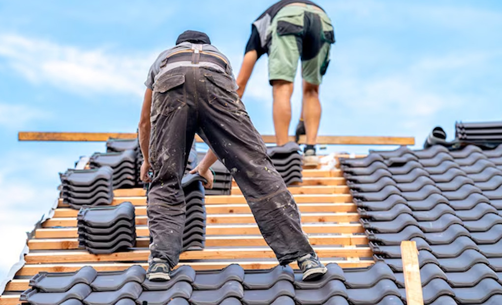 Roofers Installing A Stone Coated Steel Roof