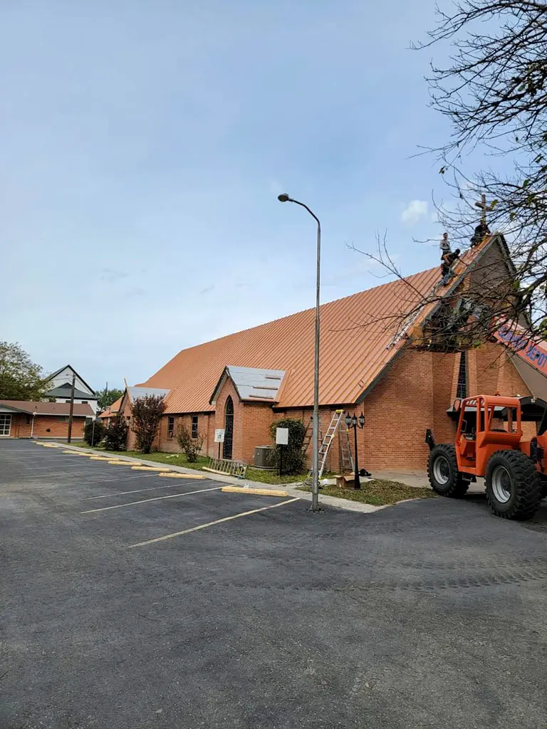 Installing a metal roof on a church in San Antonio, TX.